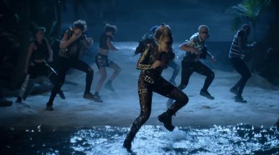 a group of people are dancing in the water