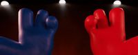 a red and a blue hand are in front of spotlights