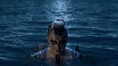 a woman in a body of water with her head in the water