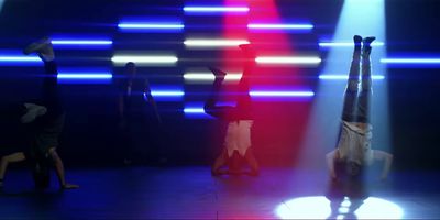 a group of people standing on top of a stage