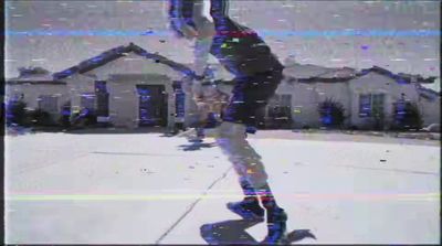 a blurry image of a person doing a trick on a skateboard