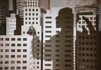 a shadow of a man standing in front of tall buildings