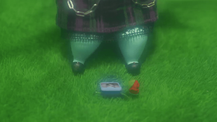 a person standing in the grass with a frisbee