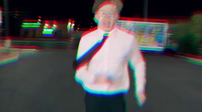 a blurry image of a man wearing a tie