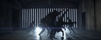 a group of people dancing in a dark room