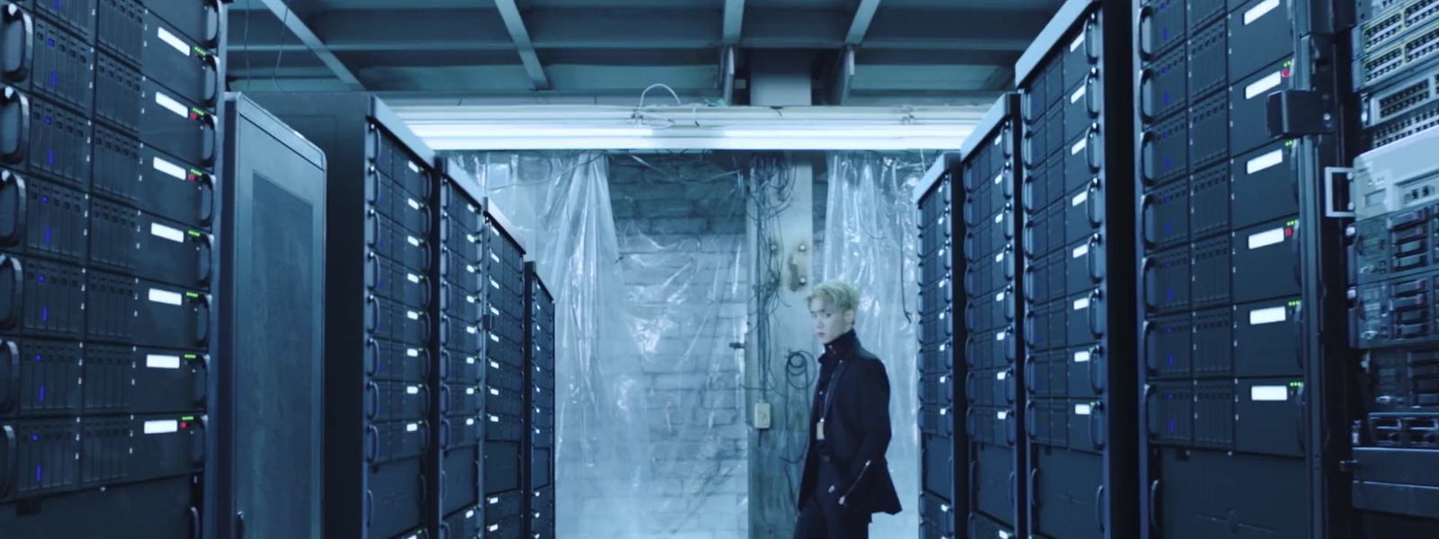 a man is standing in a server room