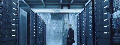 a man is standing in a server room