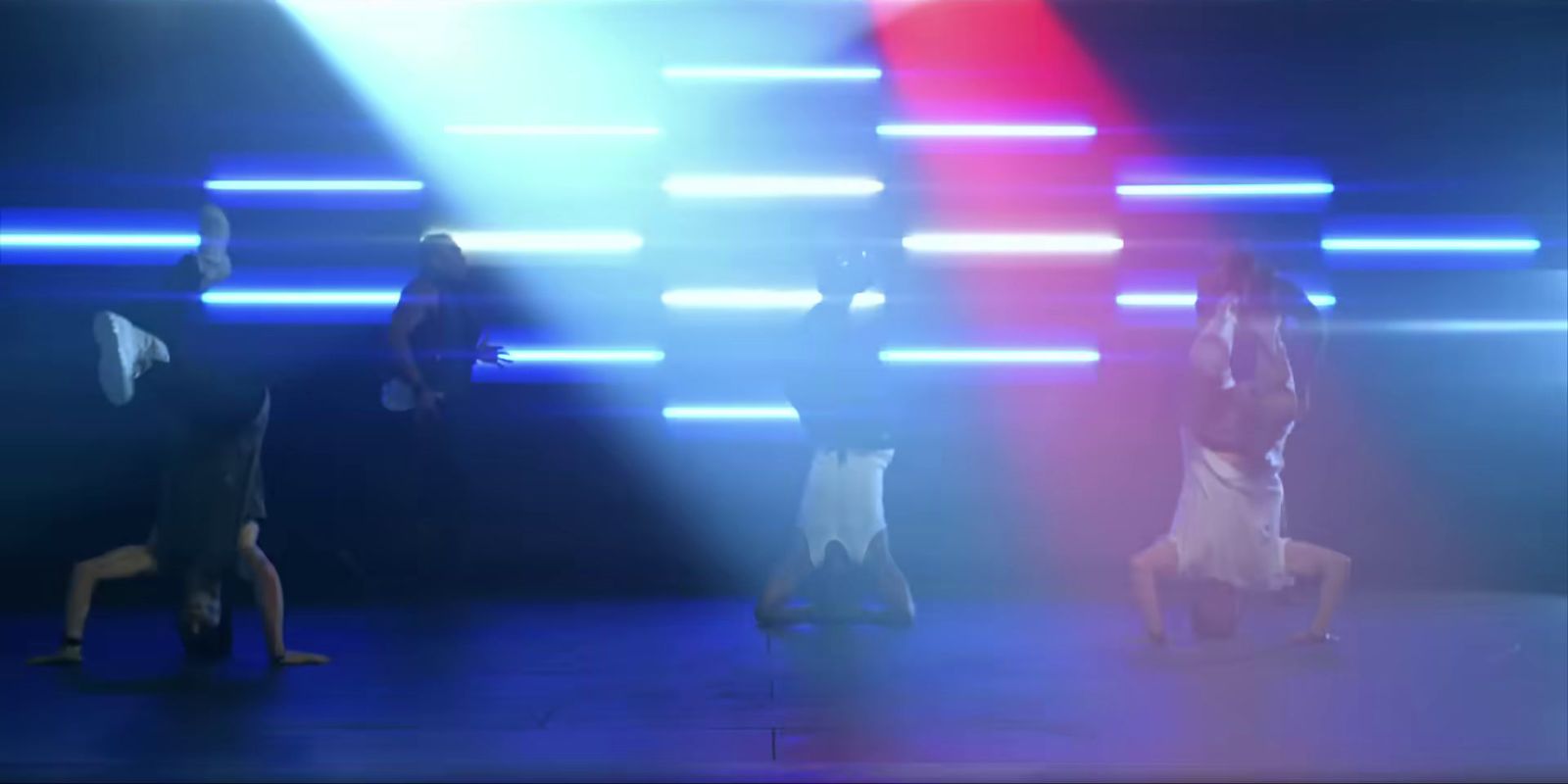 a group of people standing on top of a stage