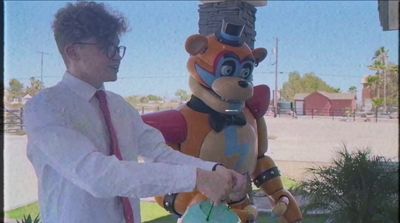 a man in a white shirt and tie shaking hands with a cartoon character