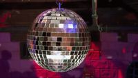 a disco ball hanging from a ceiling in a room