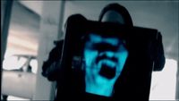 a blurry photo of a person holding a cell phone
