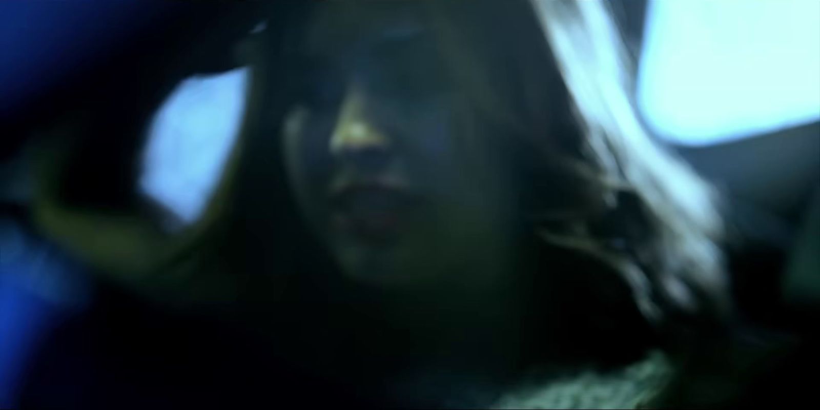 a blurry photo of a woman in a car