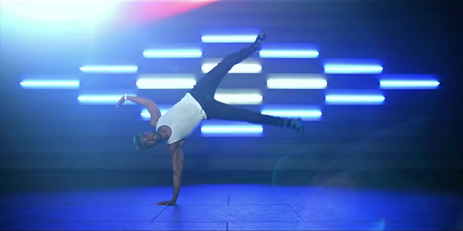 a person doing a handstand on a stage