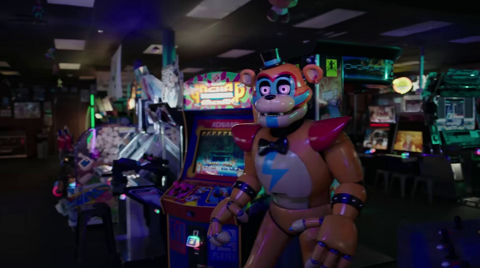 a video game room with a robot playing a video game