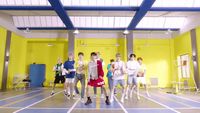 a group of young men standing in a gym