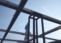 a person on a snowboard going down a ramp