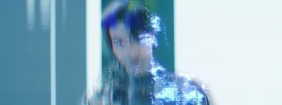 a blurry photo of a person in a suit