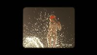 a man in a red hat is spraying water