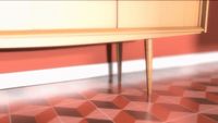 a wooden table sitting on top of a checkered floor