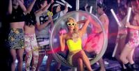 a woman in a yellow bathing suit sitting in a bubble