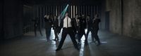 a group of men in suits and ties dancing