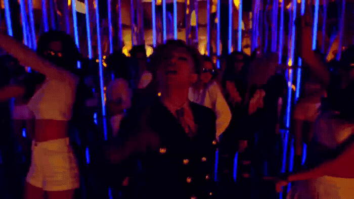 a group of people standing around each other