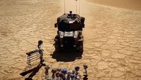 a group of people standing around a vehicle in the desert