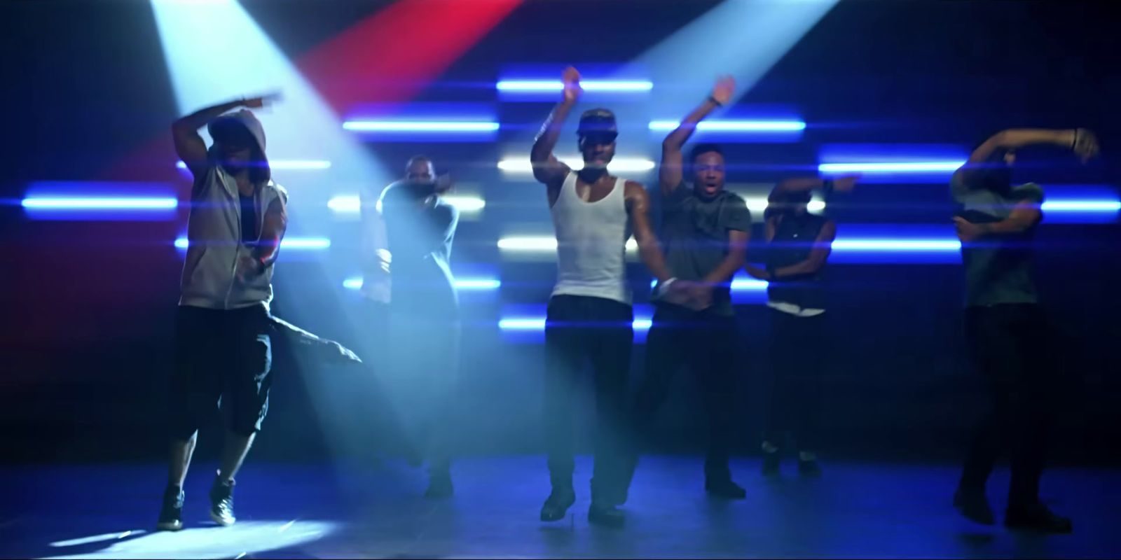 a group of people standing on top of a stage