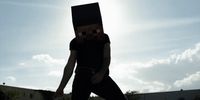 a man in a black shirt is on a skateboard