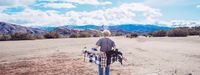 a man standing in the middle of a desert