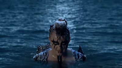 a woman in a body of water with her head in the water