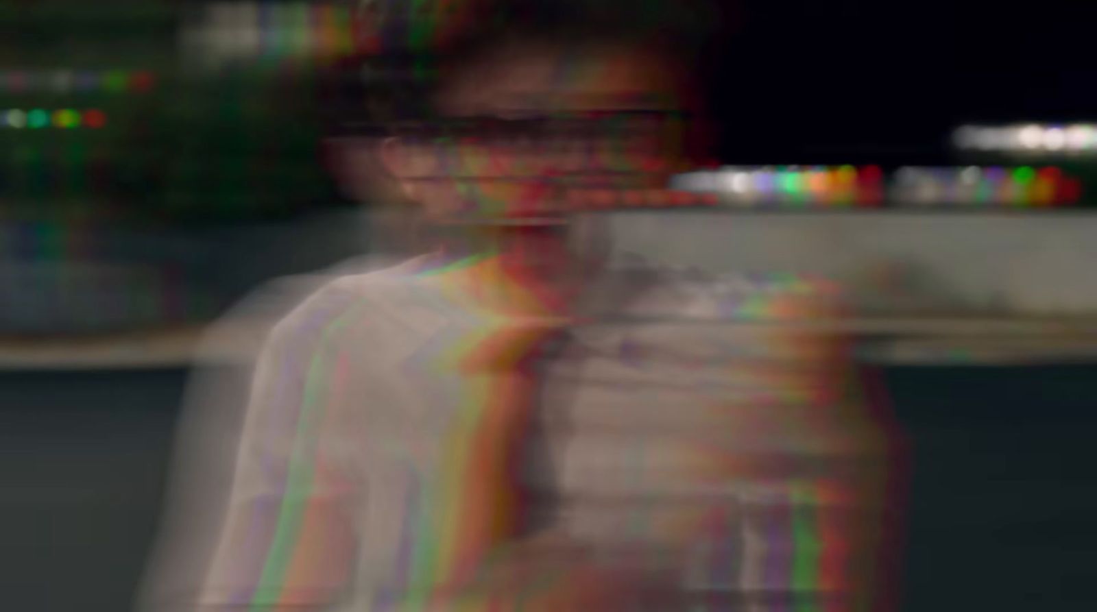 a blurry photo of a person with a cell phone