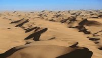 a view of a desert with a lot of sand dunes