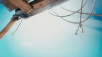 a close up of a wooden pole with ropes