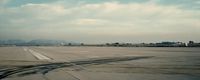 an airport tarmac with a sky background