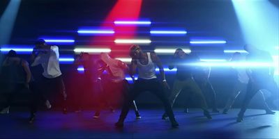 a group of people dancing on a stage