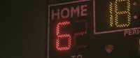 a close up of a street sign with lights