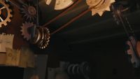 a bunch of gears hanging from a ceiling