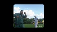 a couple of men standing on top of a lush green field