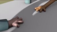 a cartoon hand reaching for something on a table