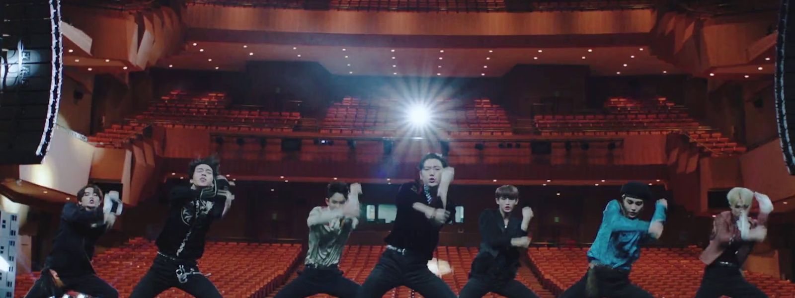 a group of young men dancing on a stage