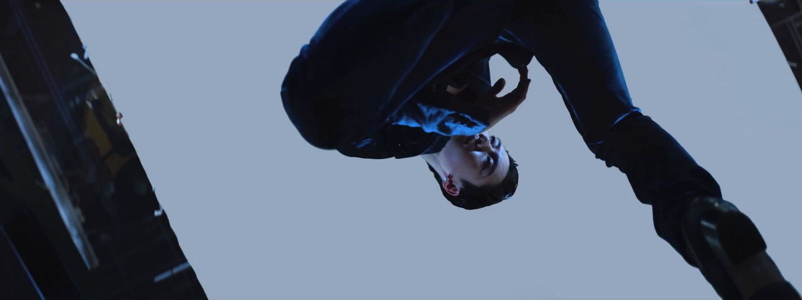 a man hanging upside down in the air