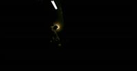 a person standing in the dark with a light on