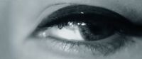 a black and white photo of a person's eye