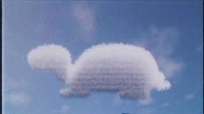 a cloud shaped like a rabbit is in the sky