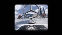 a close up of a mercedes emblem on a car