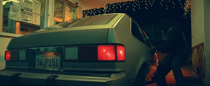 a car is parked in front of a building