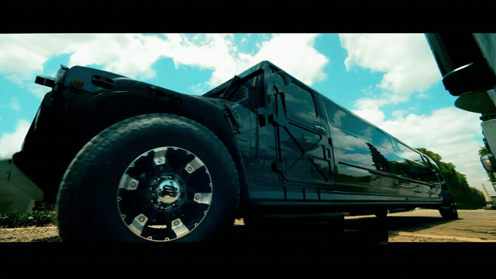 a black truck parked on the side of a road