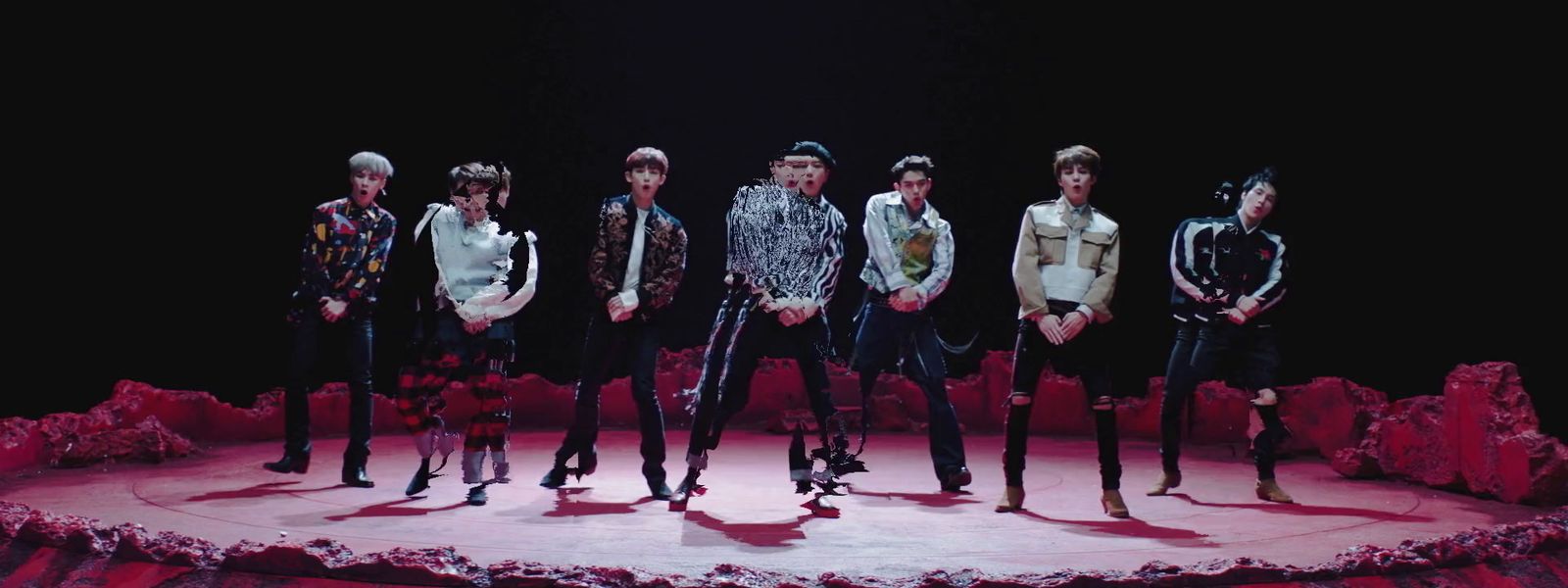 a group of young men standing on top of a stage