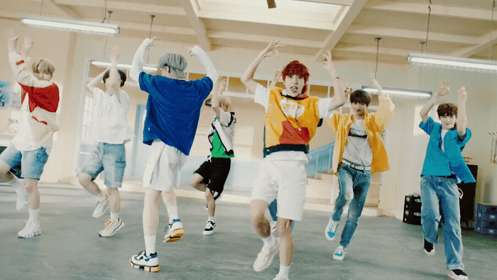 a group of young men jumping in the air